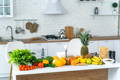 Fruits and vegetables on a display in the kitchen.