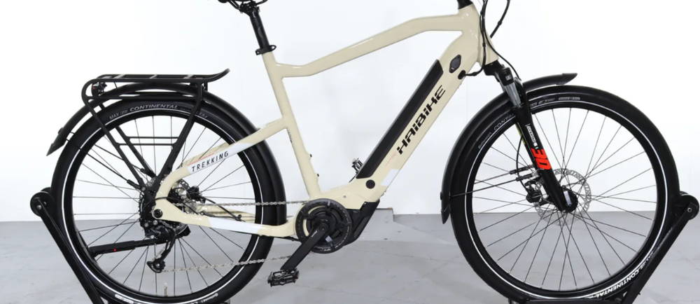 a cream colored Haibike Trekking 4 front suspension electric mountain bike