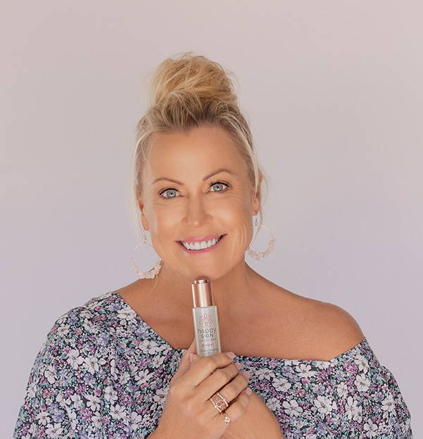 Woman Holding Facial Serum Smiling - Happy Healthy You