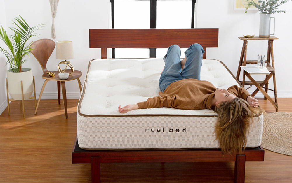 Man in bed with stylishly decorated room. Image