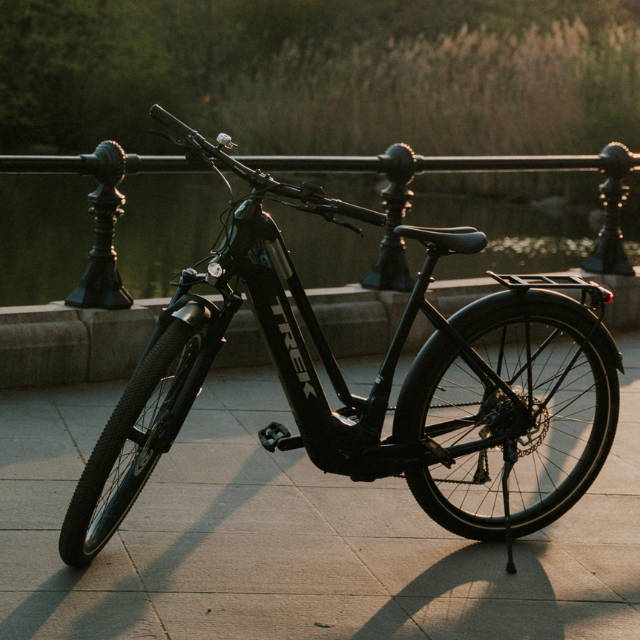 a black Trek Allant on a bike path near water