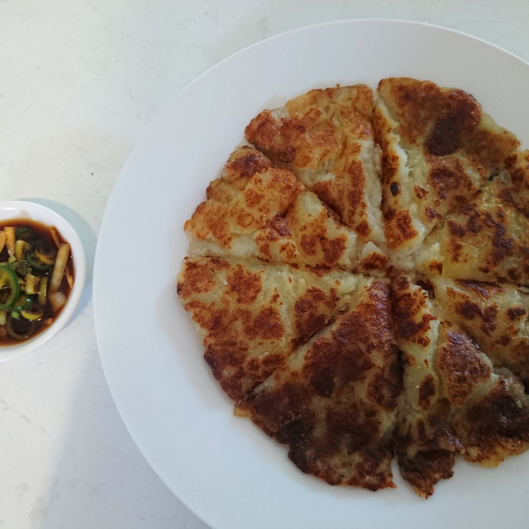 Date: 21 Oct 2019 (Mon)
5th Snacks: Gamjajeon - 감자전 (Potato pancake): [74] [100.0%] [Score: 8.0]
Author: Maangchi
Cuisine: Korean
Dish Type: Snack

The inside of Gamjajeon: 감자전 is chewy and soft, and the outside is a little crispy and crunchy like a french fry. The grated onion totally makes it: onion and potato is a good combination! If you have a potato, just grate and make and serve with a glass of milk! It’s also much better with the sauce, which is optional, but highly recommended.