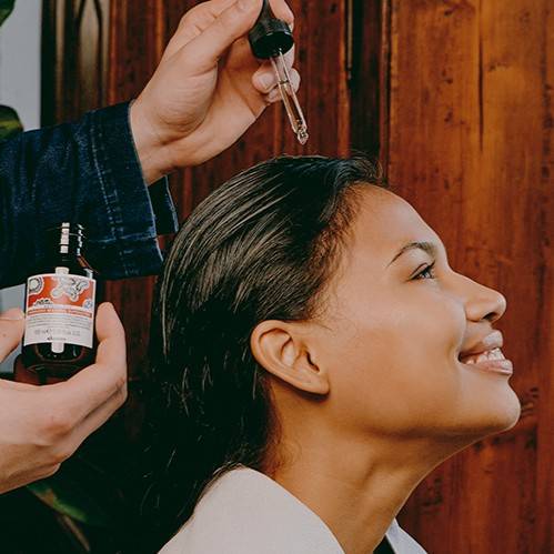 woman getting Davines Naturaltech ENERGIZING treatment in a salon