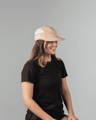 EV2 Sportswear model wearing an EV2 Pro Cap in Beige