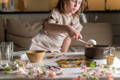 Girl making a DIY project with a boiled egg.