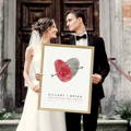 wedding couple holding fingerprint couples artwork