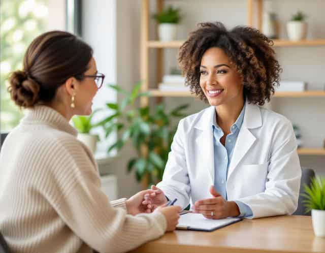 Naturopathic practitioner with patient