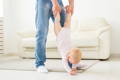 Parent not helping baby to learn to walk