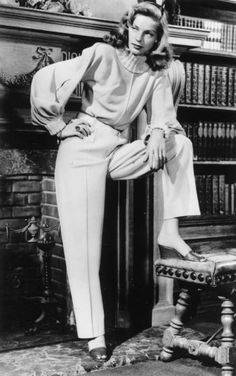 Lauren bacall in trousers and blouse with bishops sleeves