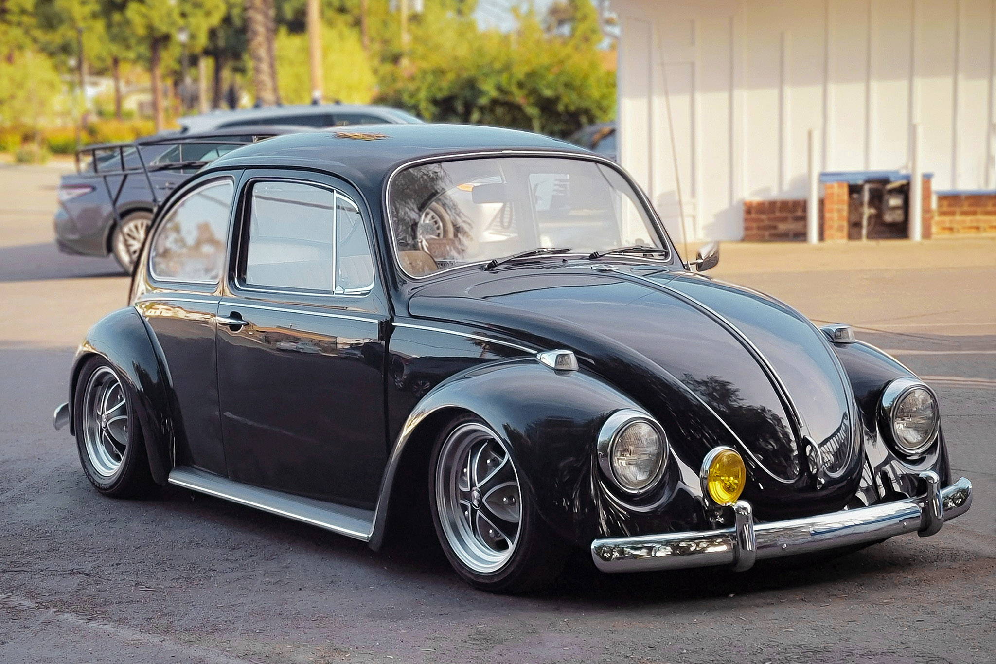 black volkswagen beetle on black machined with gray klassik rader falcon wheels