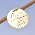 a round disc charm featuring mum's handwriting. a great gift idea for memorial jewellery