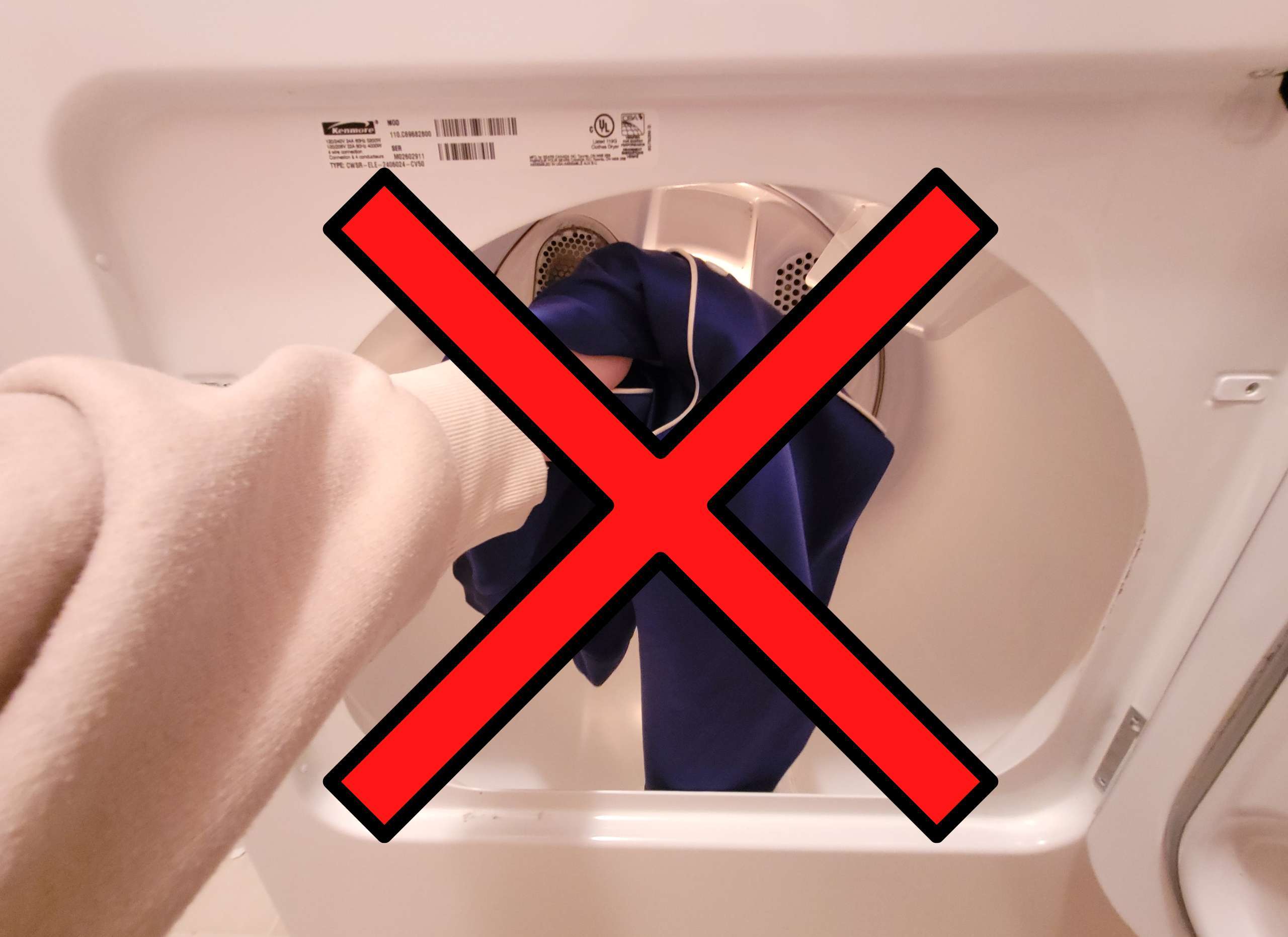 photo of a satin garment being put in the dryer