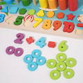Close-up of a colorful wooden Montessori Smart Board children's toy with rings, shapes, and numbers. 