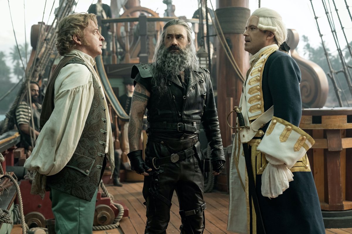 Ed and Stede facing another ship's captain in a confrontation onboard a ship.