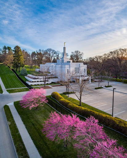 Winter Quarters Temple near pink and purple blossoms. 