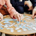 child-doing-puzzle-on-table