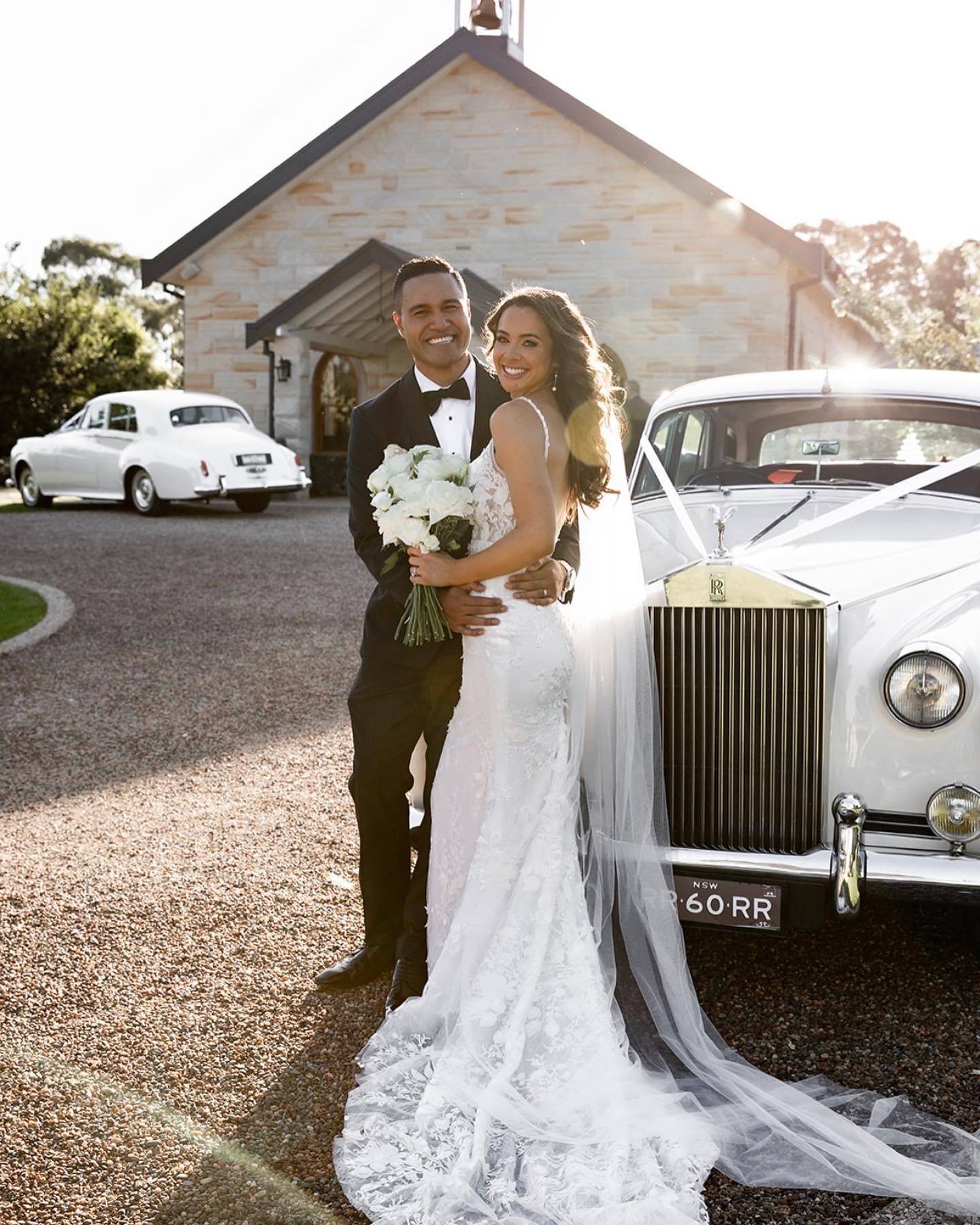 Peterson House Wedding Couple. Bride and Groom standing in front of sandstone chapel in the Hunter Valley