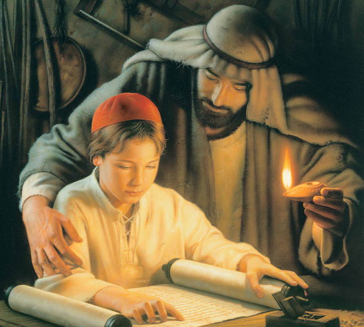 Joseph holding a glowing lamp reading from a scroll with the young Jesus.