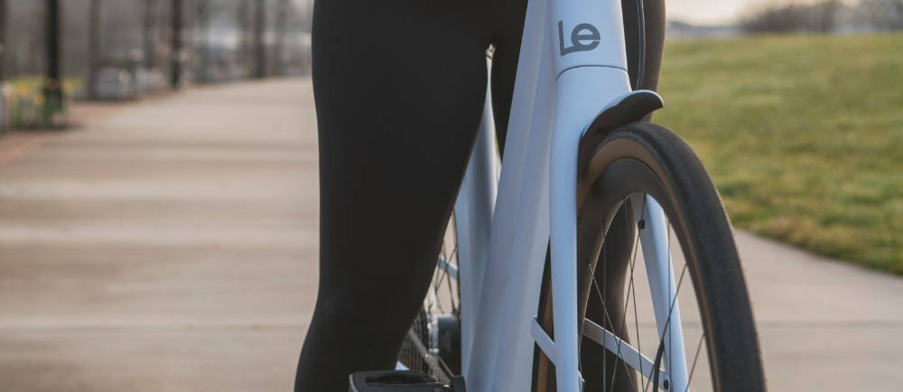 a woman in leggings on a LeMond electric bike