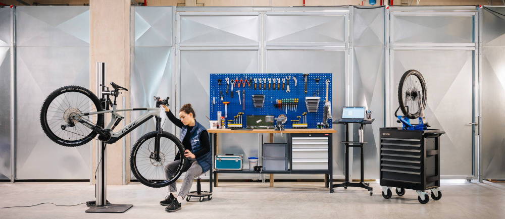 A woman working on an electric bike