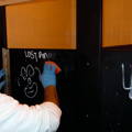 removing graffiti from bathroom stalls using graffiti safewipes