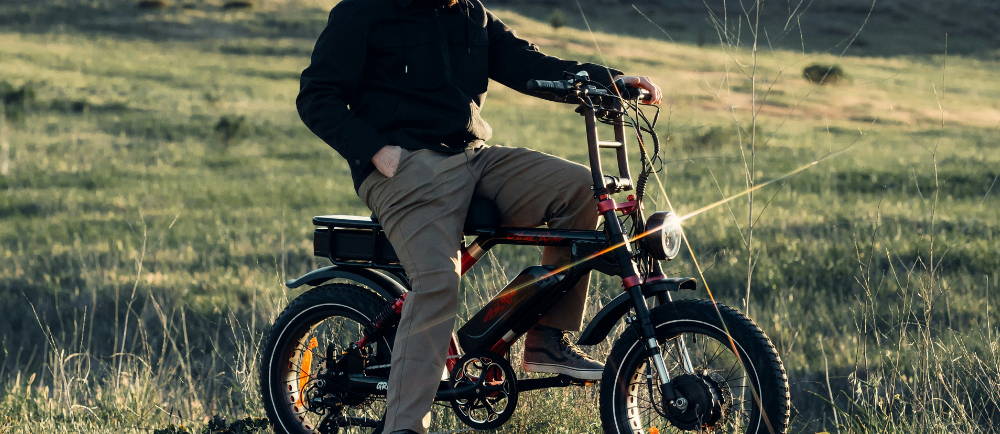 a man standing over a SUPER73 electric mini moto