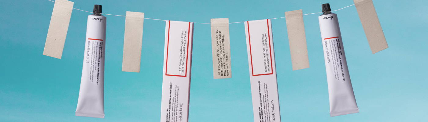 Davines The Present Time demi-permanent hair color products, hanging from a string like clothes