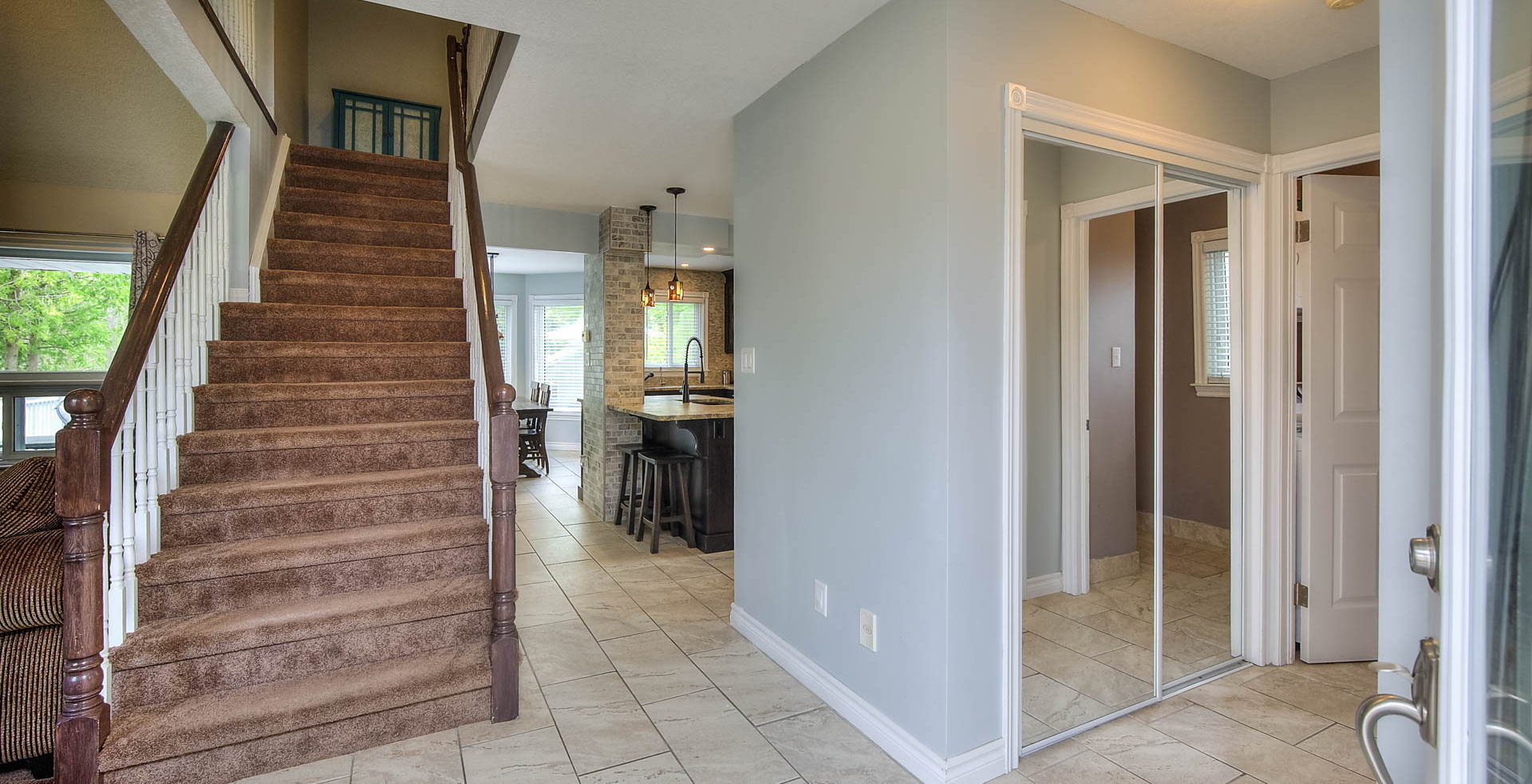 staircase featuring tile flooring and natural light