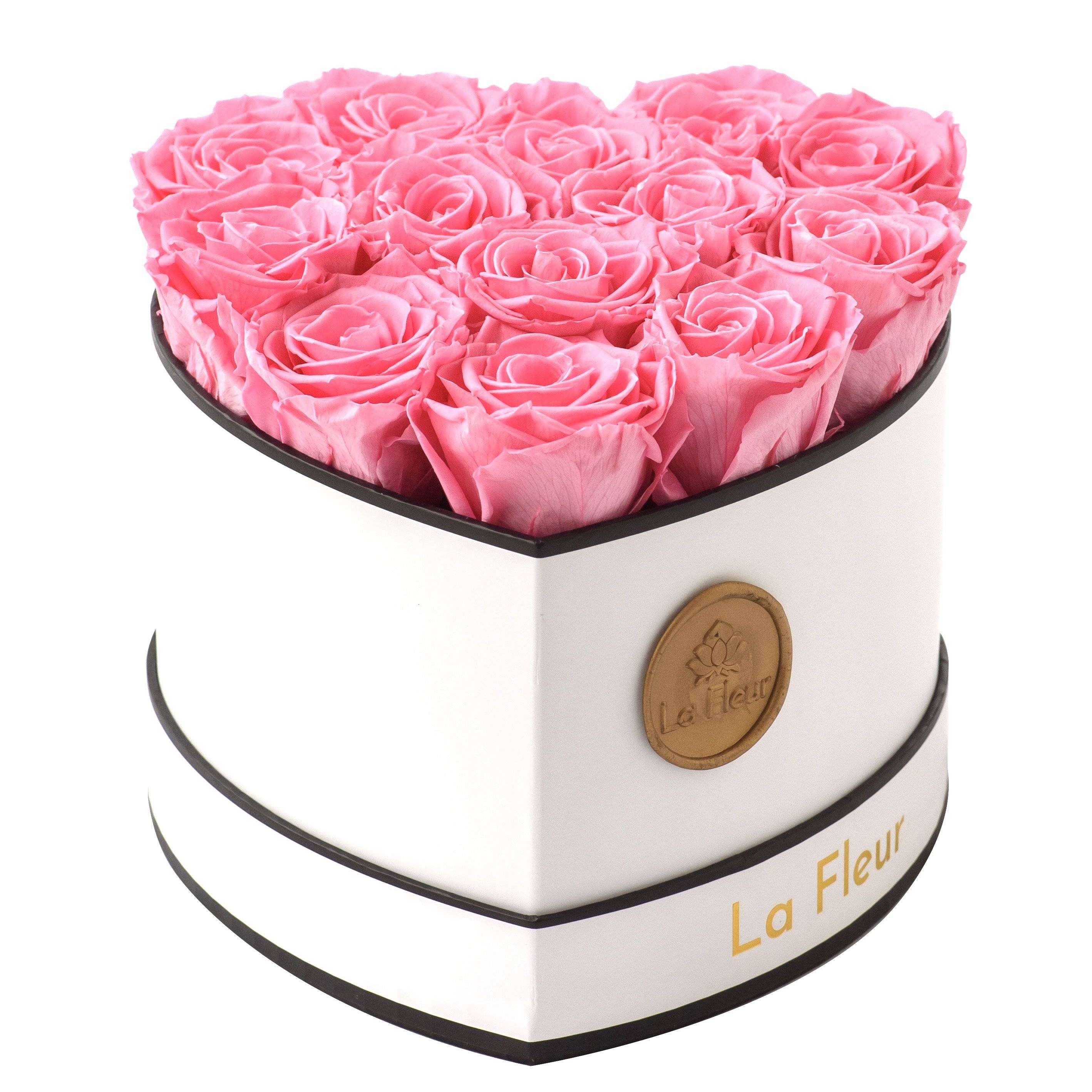 Pink roses in a heart shaped box