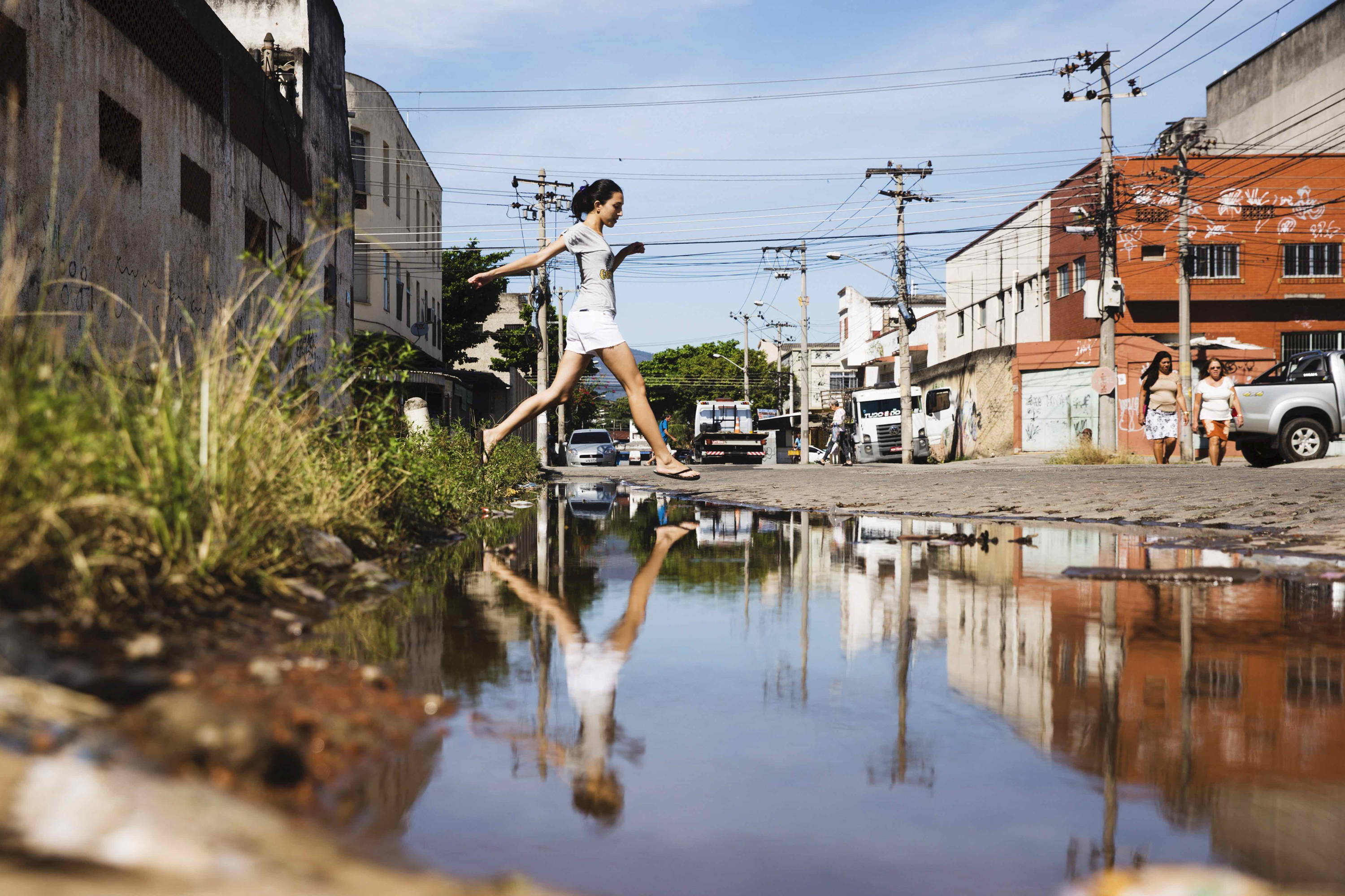 Thais jumping over a pool of water as a child