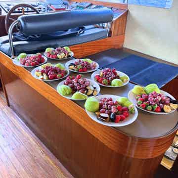 Enjoy tour by yacht with snacks and fruits