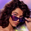 woman with freshly waxed eyebrows looking over her sunglasses