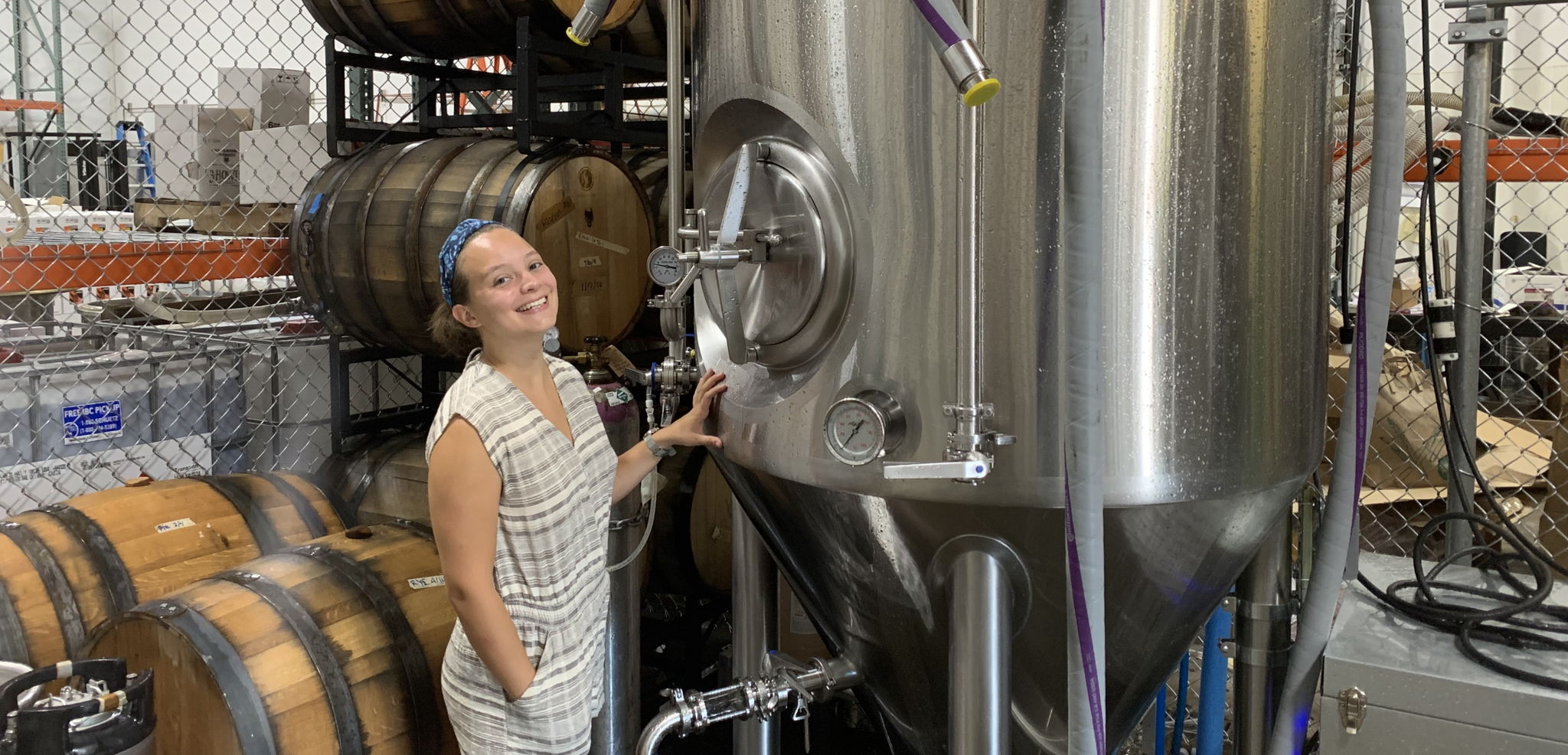 Mariana Gonzalez photo with cider tank and barrels