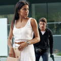 latin-female-getting-stun-gun-from-purse