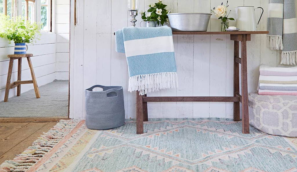 andalucia paloma summerhouse rug with table and accessories