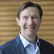 After Switzerland's ISO endorses Fi360's AIF accreditation, CEO Bill Mueller flips the firm to Broadridge Financial Solutions for a cool $120 million--a 10-fold premium