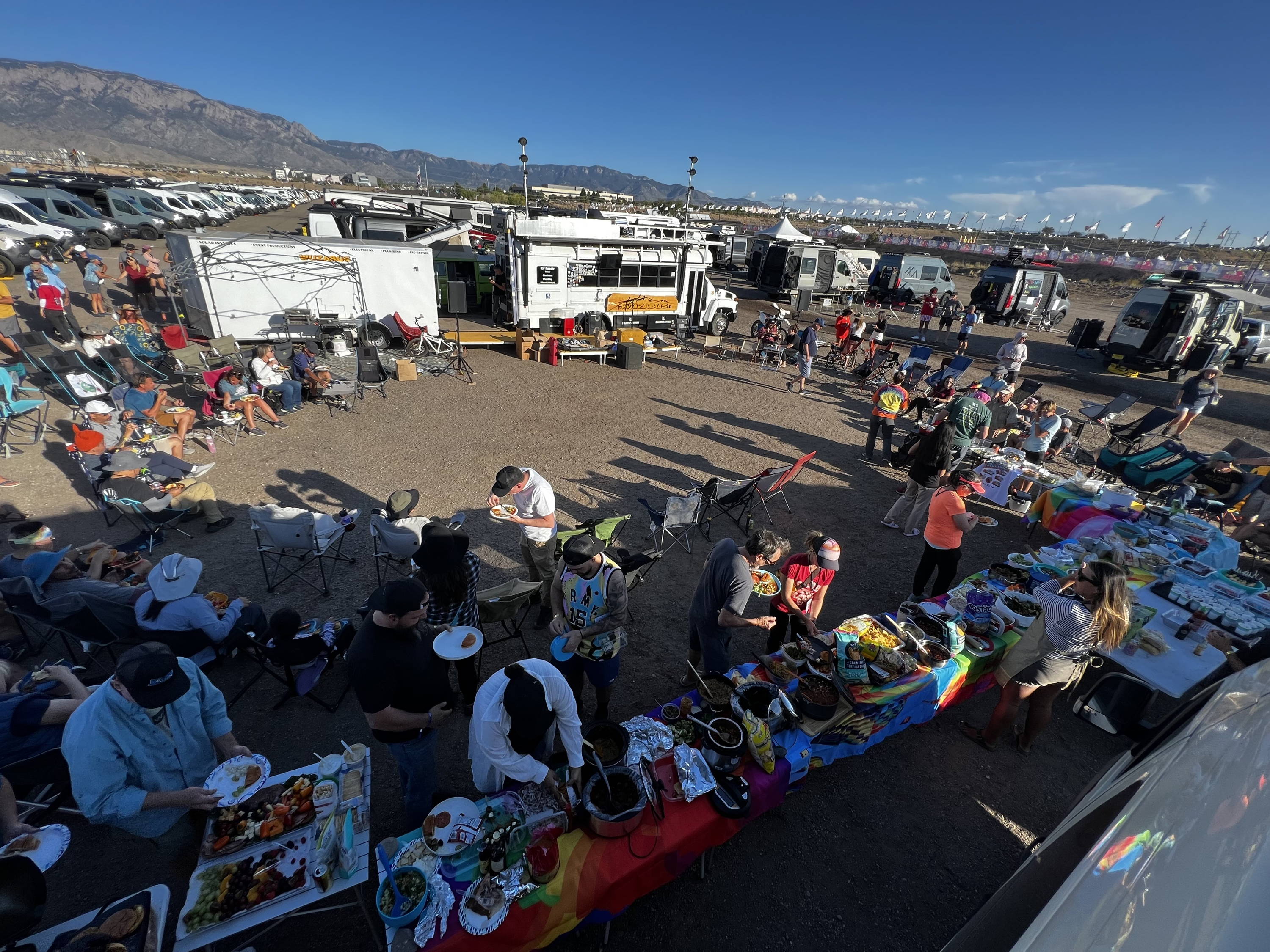 Storyteller Overland owners participate in a rainbow-themed potluck at the Albuquerque Balloon Fiesta