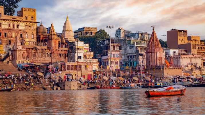 Historic Varanasi city with ancient temples and buildings along the Ganges river ghat