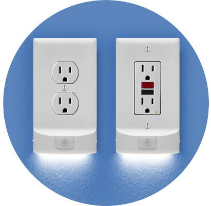 Two MotionLight hallway lighting outlet covers on a blue wall