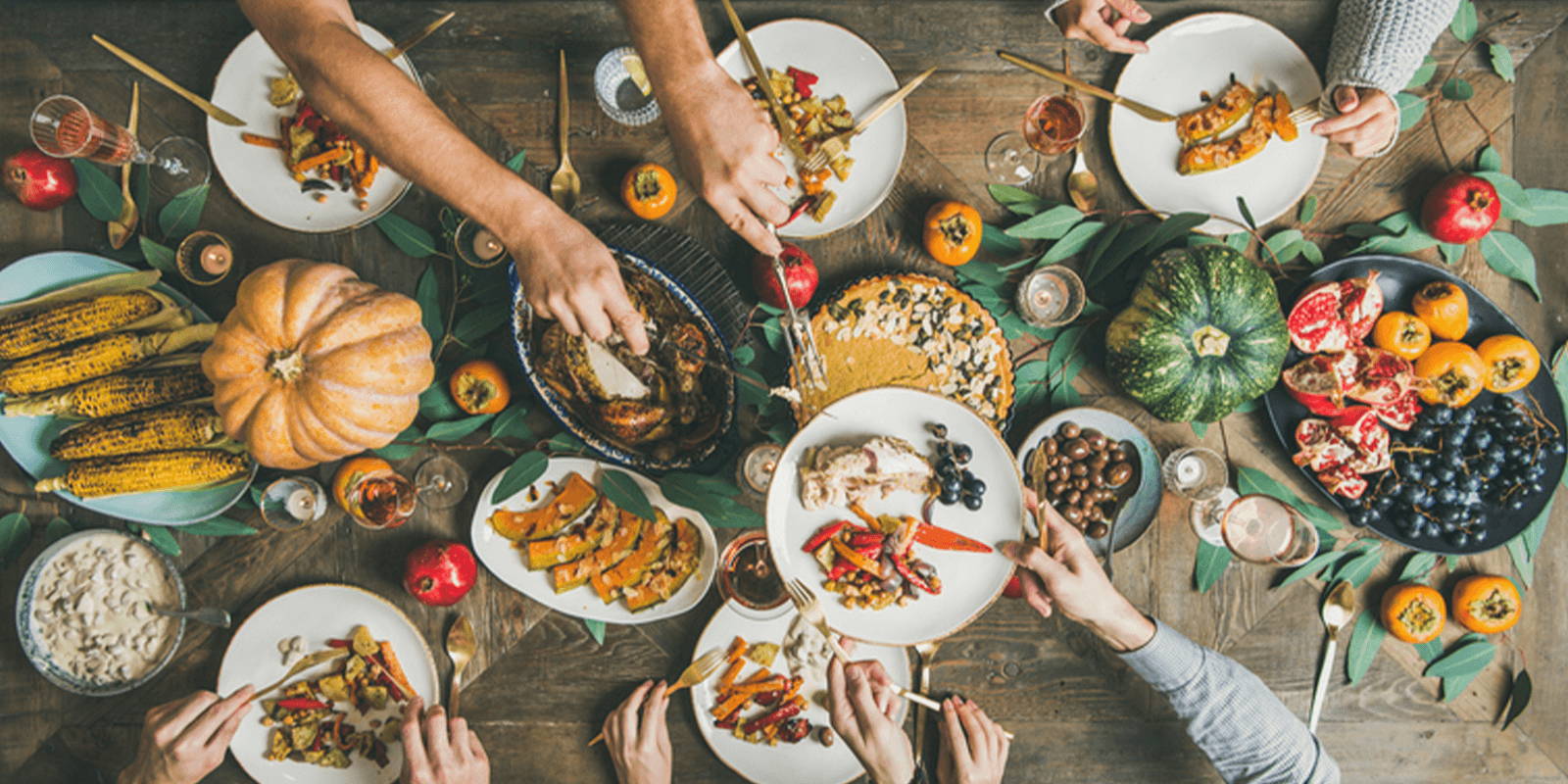 Thanksgiving table with food being served. 