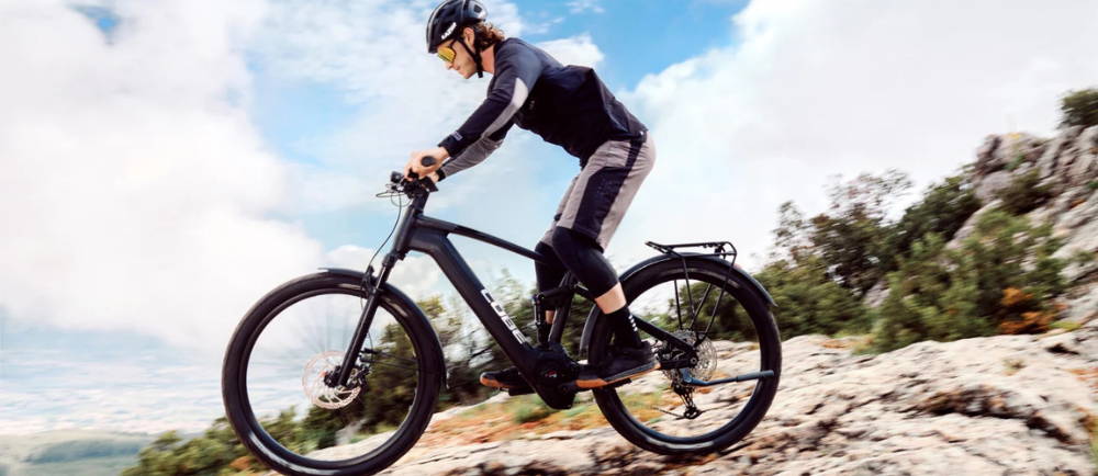 Mountain biker on Cube electric mountain bike