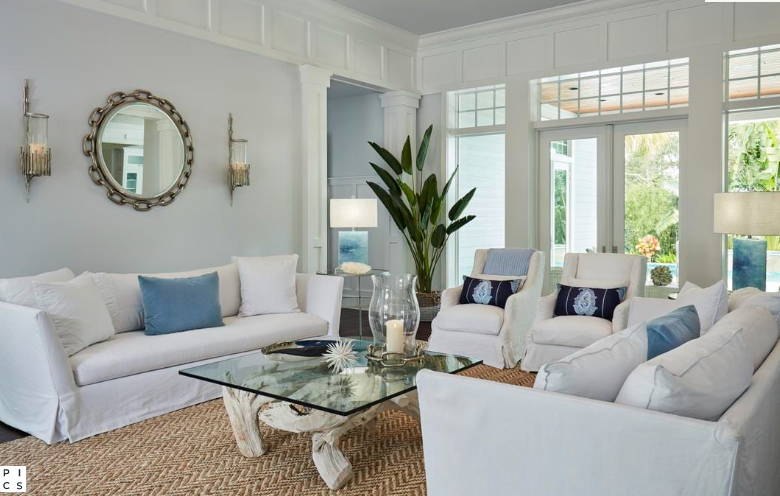 Living room with white slipcovered furniture i