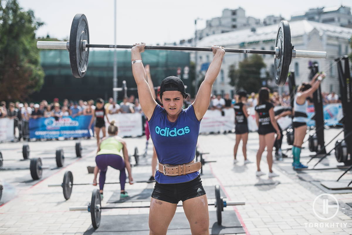 female athlete training with barbell outside female athlete training with barbell outside