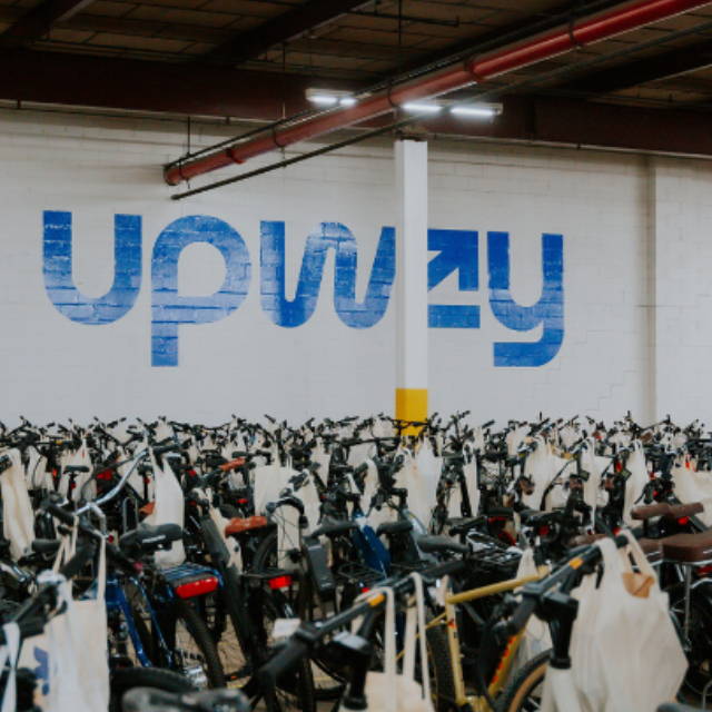 a large number of electric bikes at an Upway Center