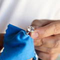 Jeweler hand polishing engagement ring