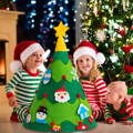 Children sitting next to the Montessori round Christmas Tree in a holiday setup. 