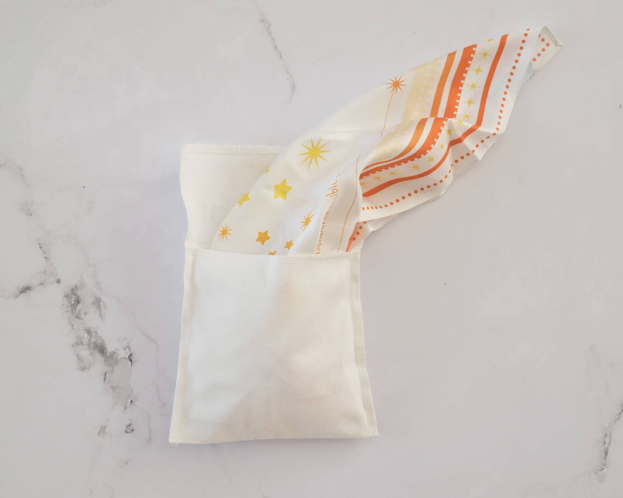 Terre des hommes Joli Nous collaboration suisse produit foulard solidaire petit prince exellence qualité enfant bébé maman papa parents