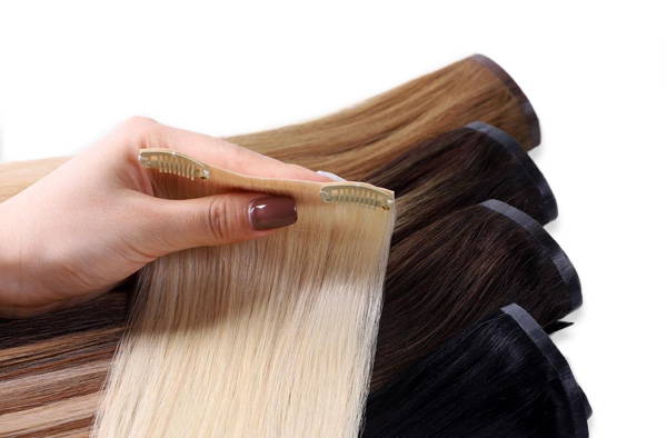 one piece of platinum blonde, jet black, off black and honey blonde seamless clip in hair extensions