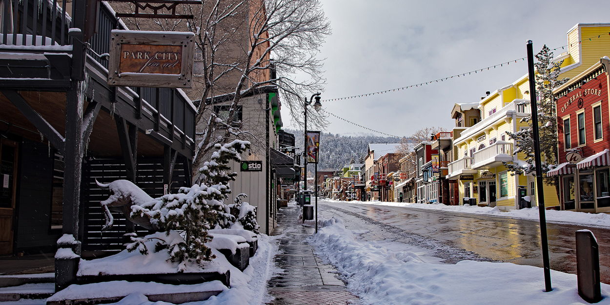 Historic Main Street and snow-covered mountains in Park City, Utah