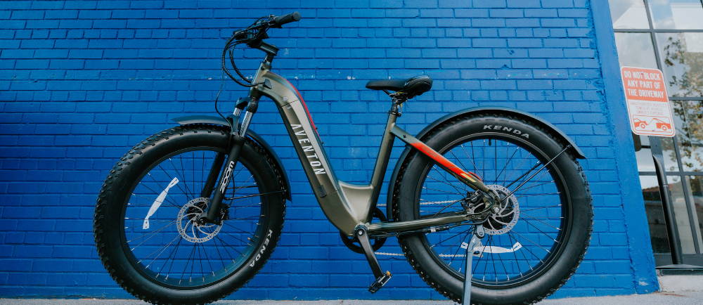 A green Aventon Aventure fat-tire electric bike